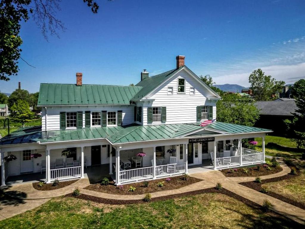 a large white house with a green roof at Elegant Historic Suite with Mountain Views in Luray, Virginia in Luray