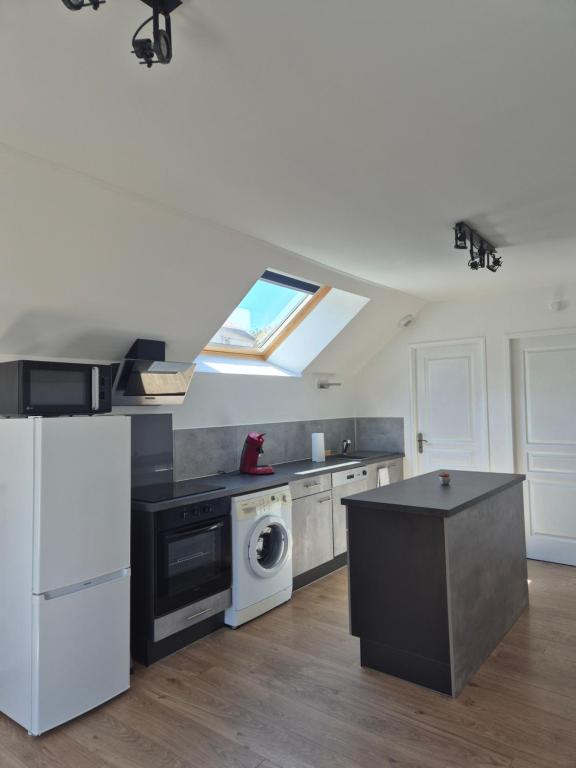 Køkken eller tekøkken på Gîte de la Gourgeonne