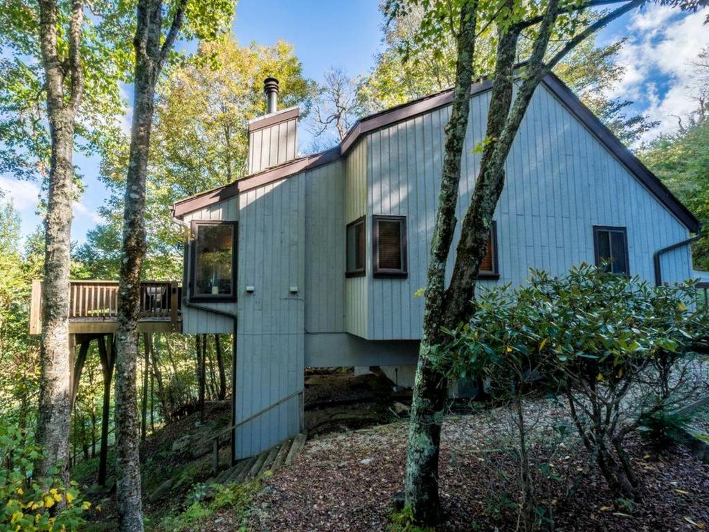 a house in the middle of the woods at Tree-House Style Cabin for Rent near Boone, North Carolina in Beech Mountain