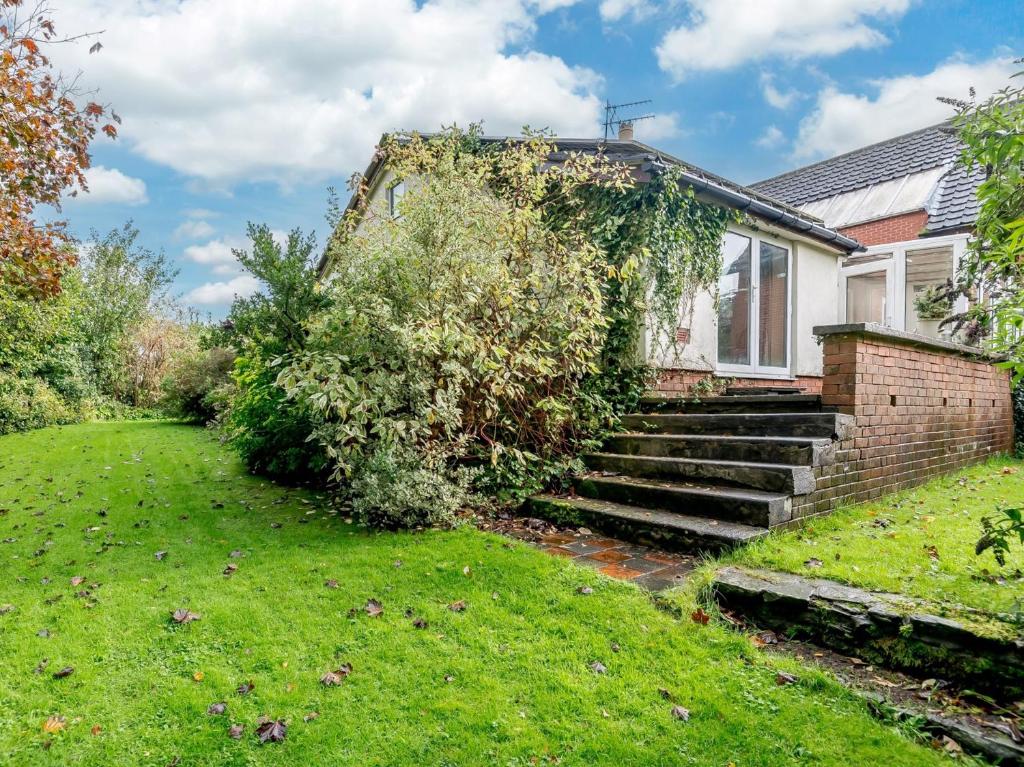a house with a ivy growing on the side of it at 2 Bed in Coleford 60103 in Coleford