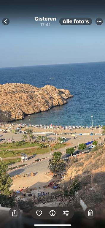 a view of a beach and the ocean at Belle cote appartement al hoceima in Al Hoceïma