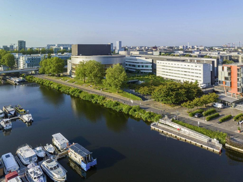 an aerial view of a river with boats docked at Novotel Nantes Centre Gare in Nantes