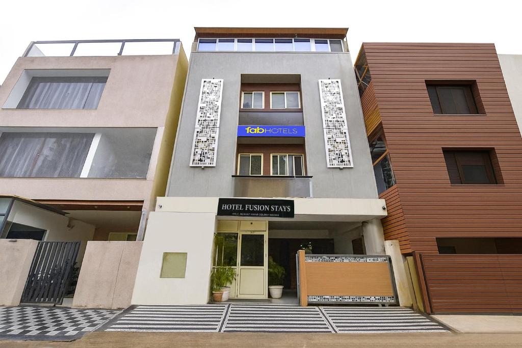 a building with the entrance to a building at FabExpress Fusion Stays in Indore