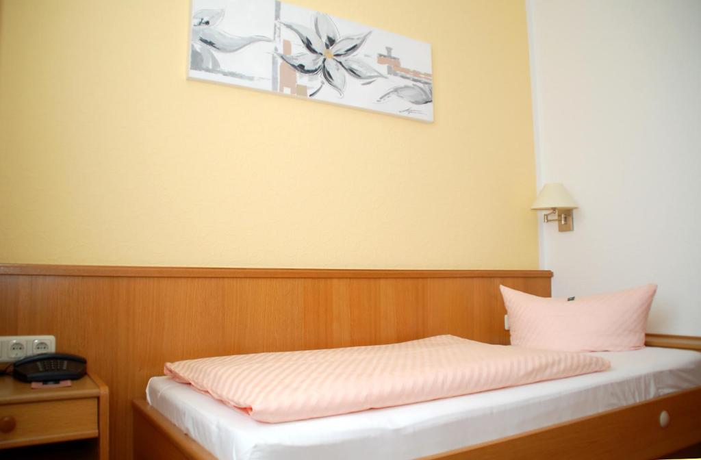 Postel nebo postele na pokoji v ubytování Hotel Goldner Anker