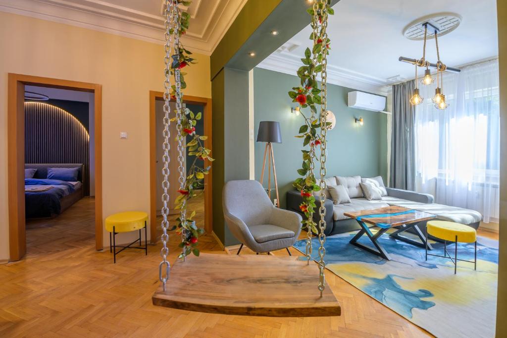 a living room with a swing and a couch at 1 Minute Walk to Main Street Vitoshka, NDK, Free Parking, 2 BDR in Sofia