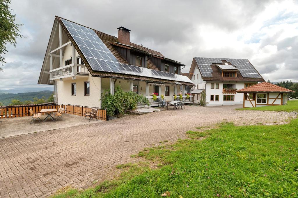 a house with a lot of solar panels on the roof at Löcherhansenhof in Bad Peterstal-Griesbach