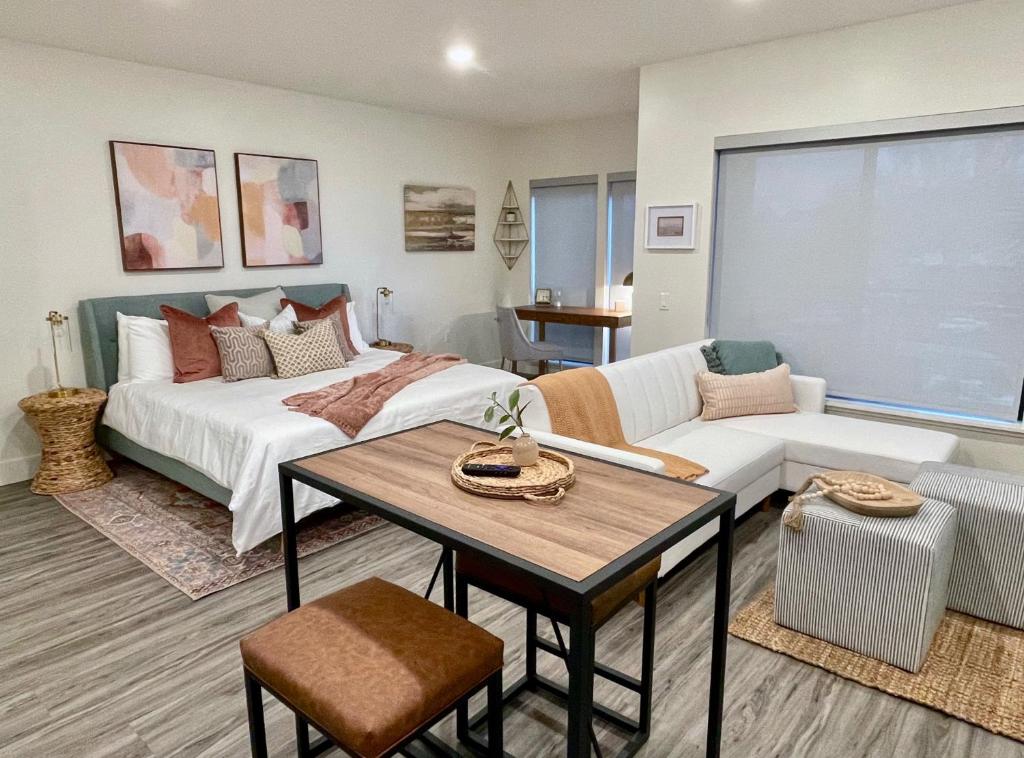 a living room with a bed and a couch at Downtown-King Bed-ADA Elevator-In Unit Laundry in Walnut Creek