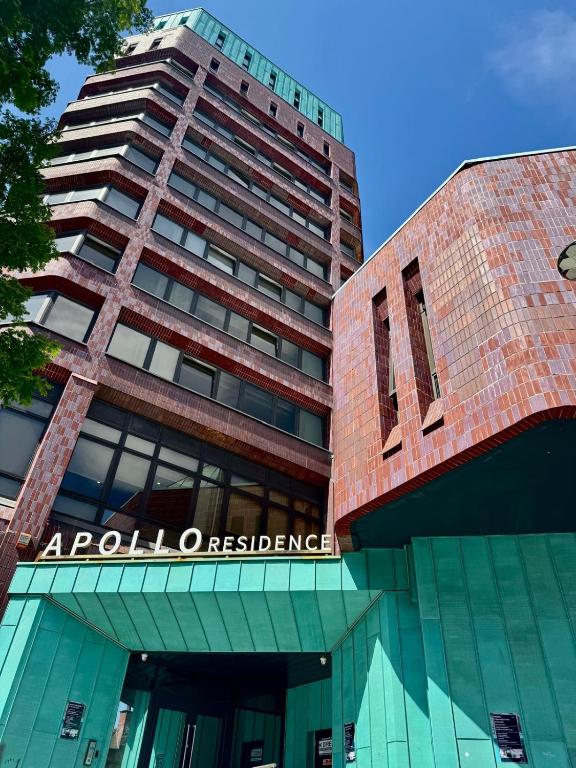 a tall building with the words apolonia assurance at Modern Studio with City Views in Sheffield