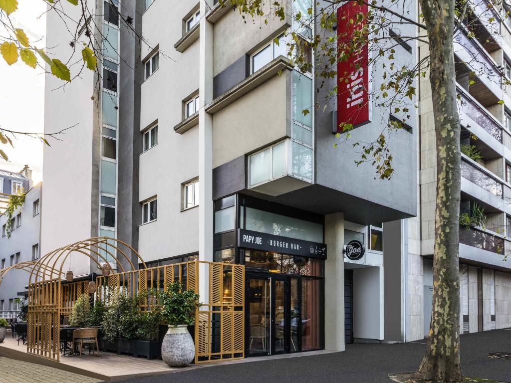 a facade of a building with a storefront at ibis Paris Place d’Italie 13ème in Paris