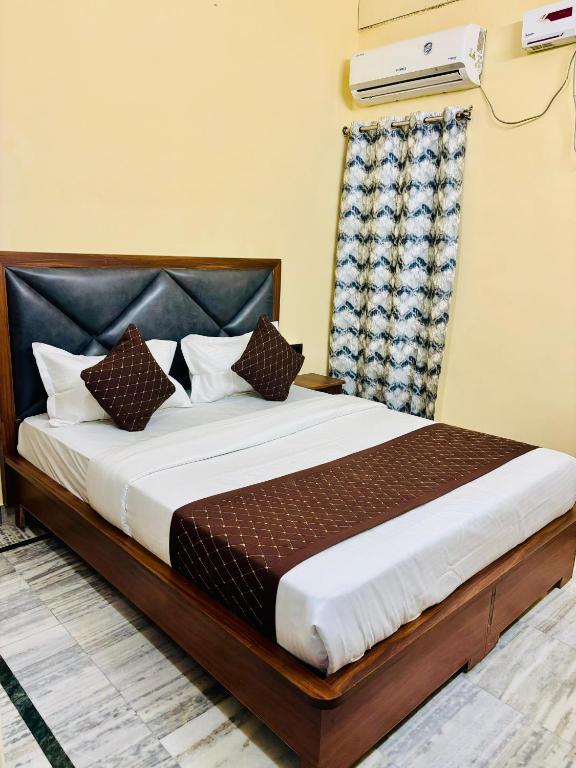 a bedroom with a bed in a room at Hotel Heritage in Varanasi
