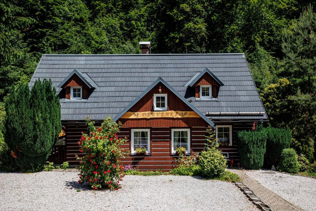 a log cabin with a gray roof at Chata 70 Dřevěnka Prkenný Důl, Žacléř, Krkonoše in Žacléř