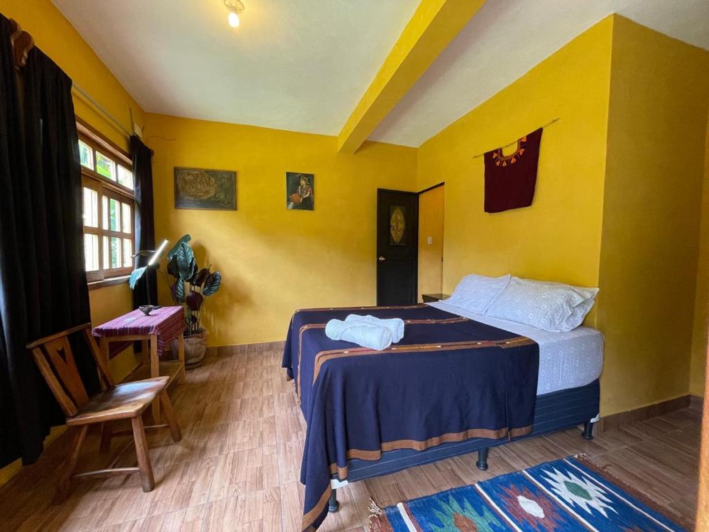 Postel nebo postele na pokoji v ubytování Casita del Sol