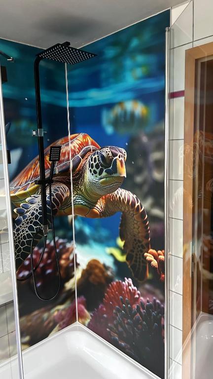 a painting of a sea turtle on a wall at Fewo Stein in Altenbeken