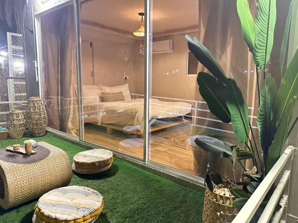 Postel nebo postele na pokoji v ubytování caravan alula