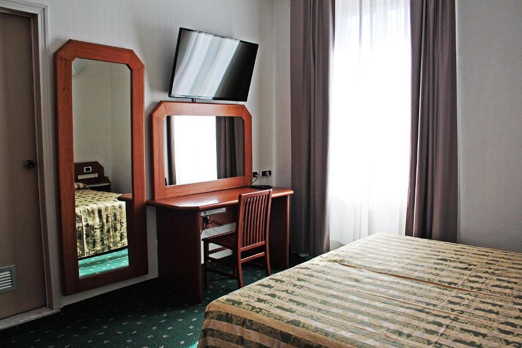 Łóżko lub łóżka w pokoju w obiekcie Hotel Centrale