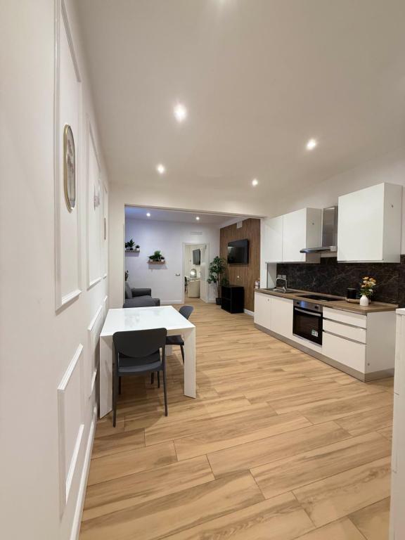 a kitchen with a table and a dining room at NAVONA MORGAN suite in Rome