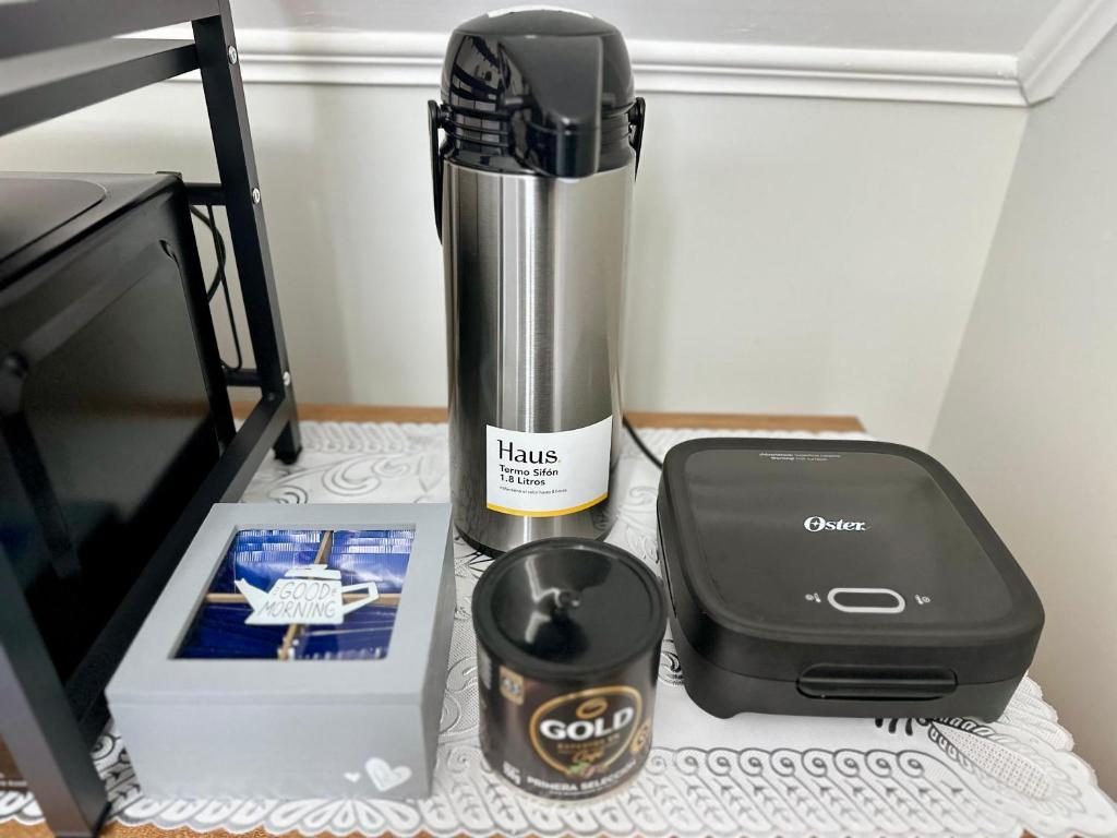 a blender sitting on a counter next to a box at Latitud Guesthouse Puerto Montt in Puerto Montt