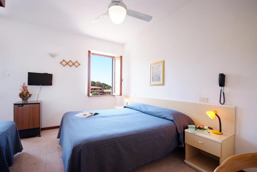 Postel nebo postele na pokoji v ubytování Hotel Anselmi