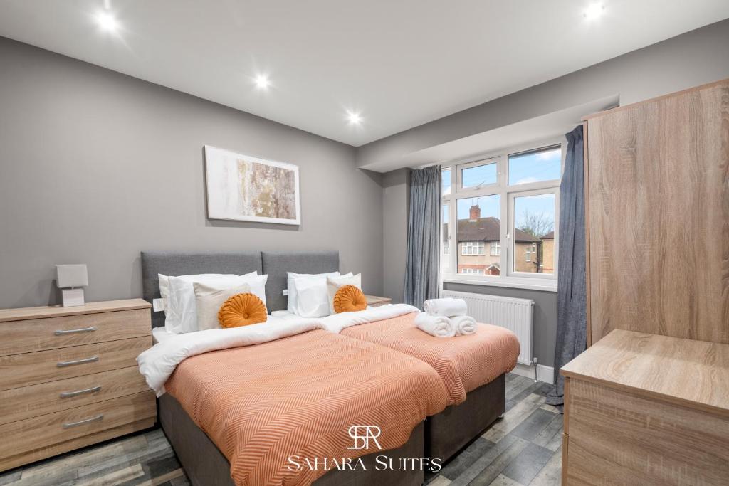 a bedroom with a bed with a dresser and a window at Guest Fav - Luxury 5BR - Reading Centre - Monthly Stays - Parking in Earley