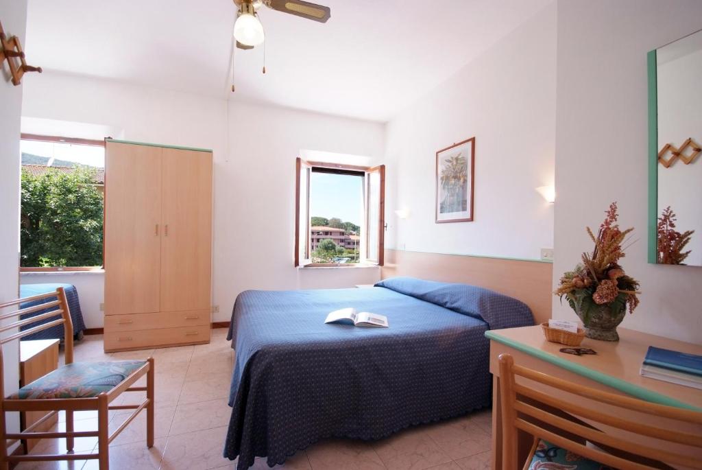 Postel nebo postele na pokoji v ubytování Hotel Anselmi