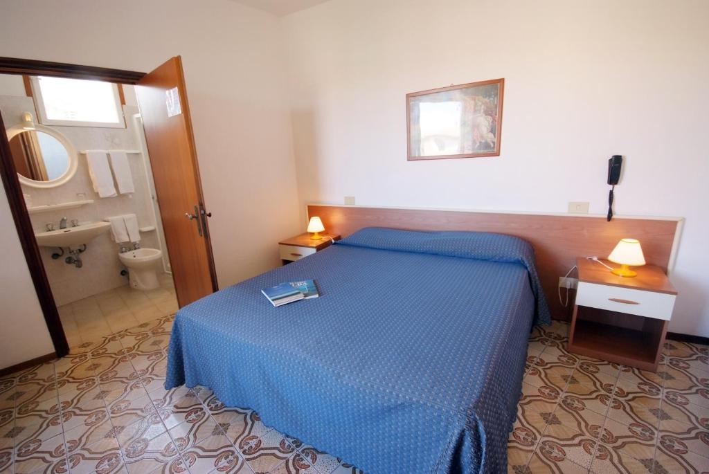 Postel nebo postele na pokoji v ubytování Hotel Anselmi