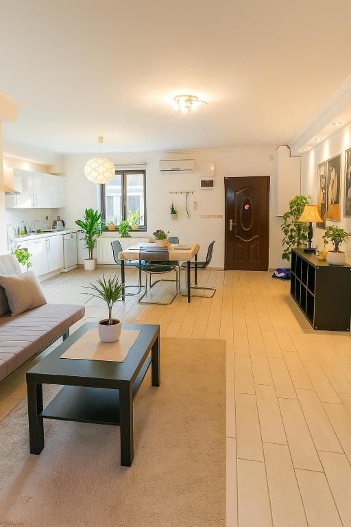 a living room with a couch and a table at Astoria Central Spacious Apartment in Budapest