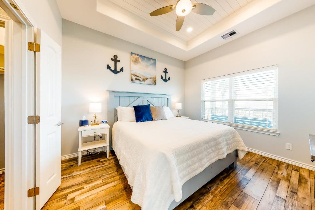 a bedroom with a bed and a window at Amazing Gulf Views Large Deck Family Fun in Hercules Offshore Heliport