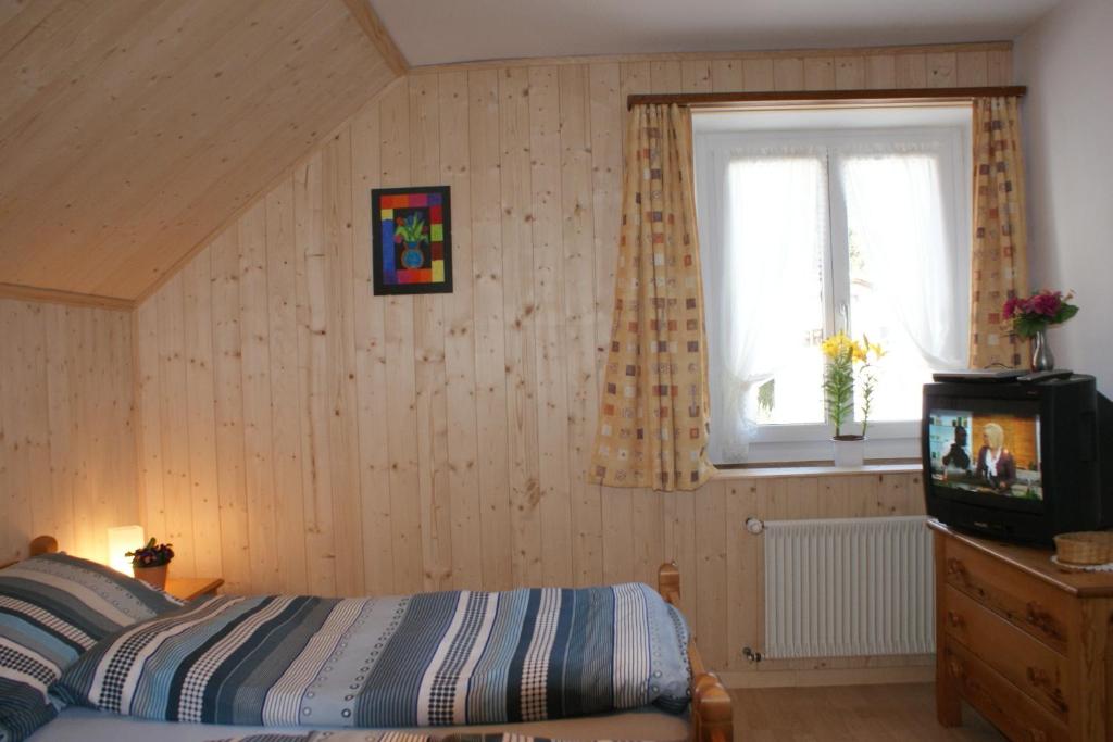 Postel nebo postele na pokoji v ubytování Gasthaus Waldheim