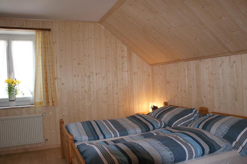 Postel nebo postele na pokoji v ubytování Gasthaus Waldheim