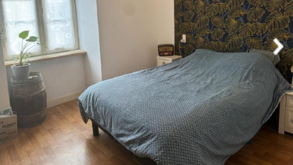 Ένα ή περισσότερα κρεβάτια σε δωμάτιο στο Chambre chez l'habitant