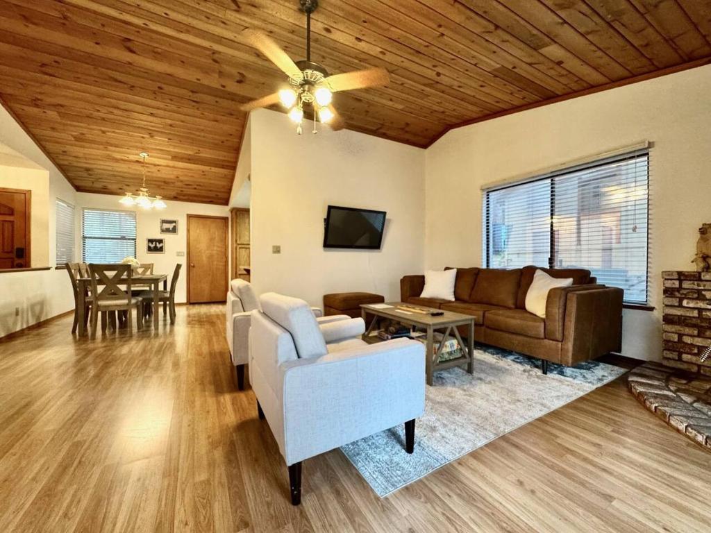 a living room with a couch and a table at Forest View Family Home in Pollock Pines