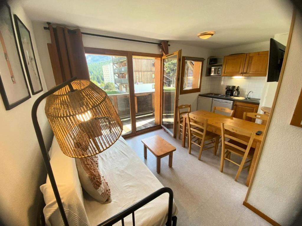 a living room with a couch and a table at Les Chalets De Superd Gentiane - APPARTEMENT 6 PERSONNES EXPO SUD BALCON MAE-8654 in Le Dévoluy