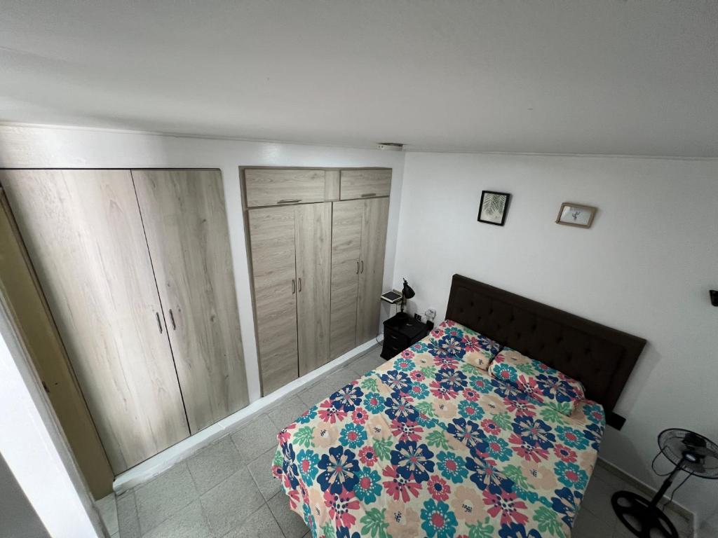 Ένα ή περισσότερα κρεβάτια σε δωμάτιο στο Apartamento Vital