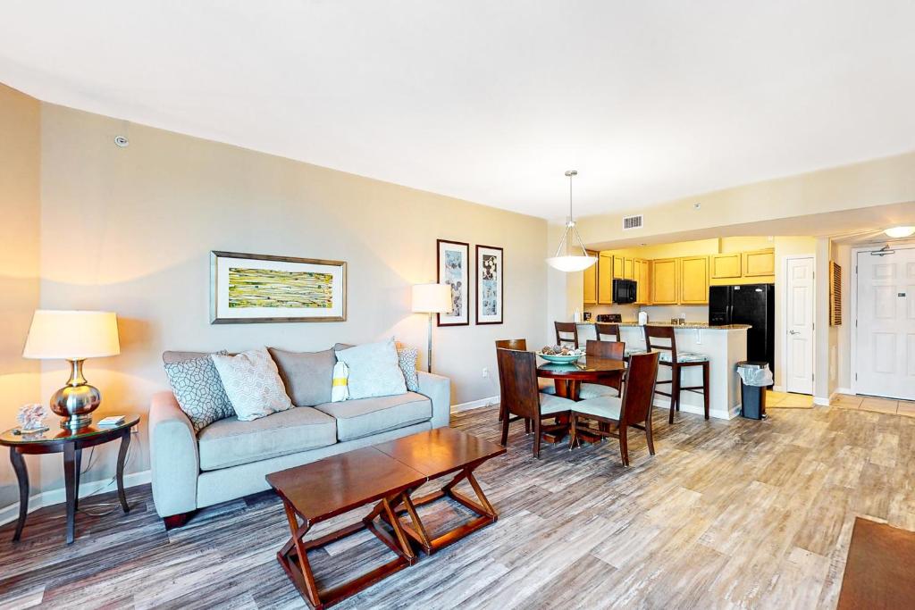 a living room with a couch and a table at Palms of Destin 1307 in Destin