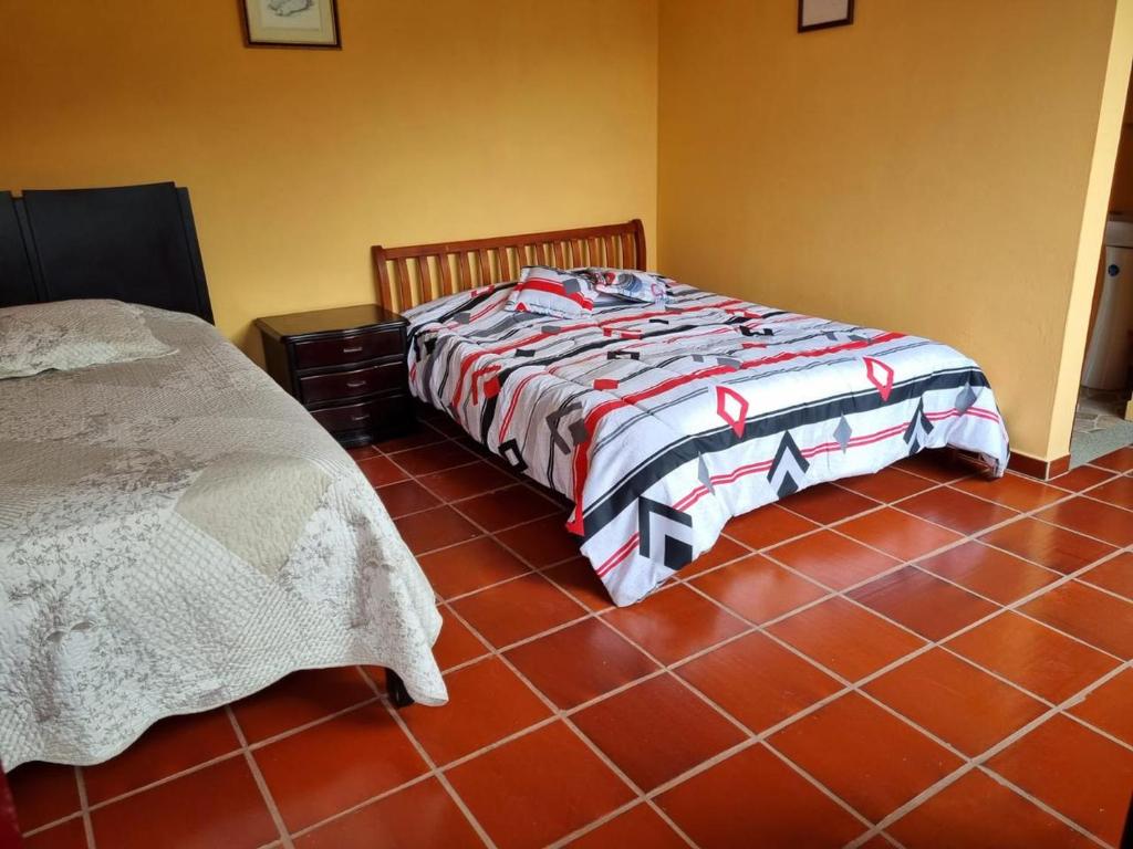 Postel nebo postele na pokoji v ubytování Posada El Remolino