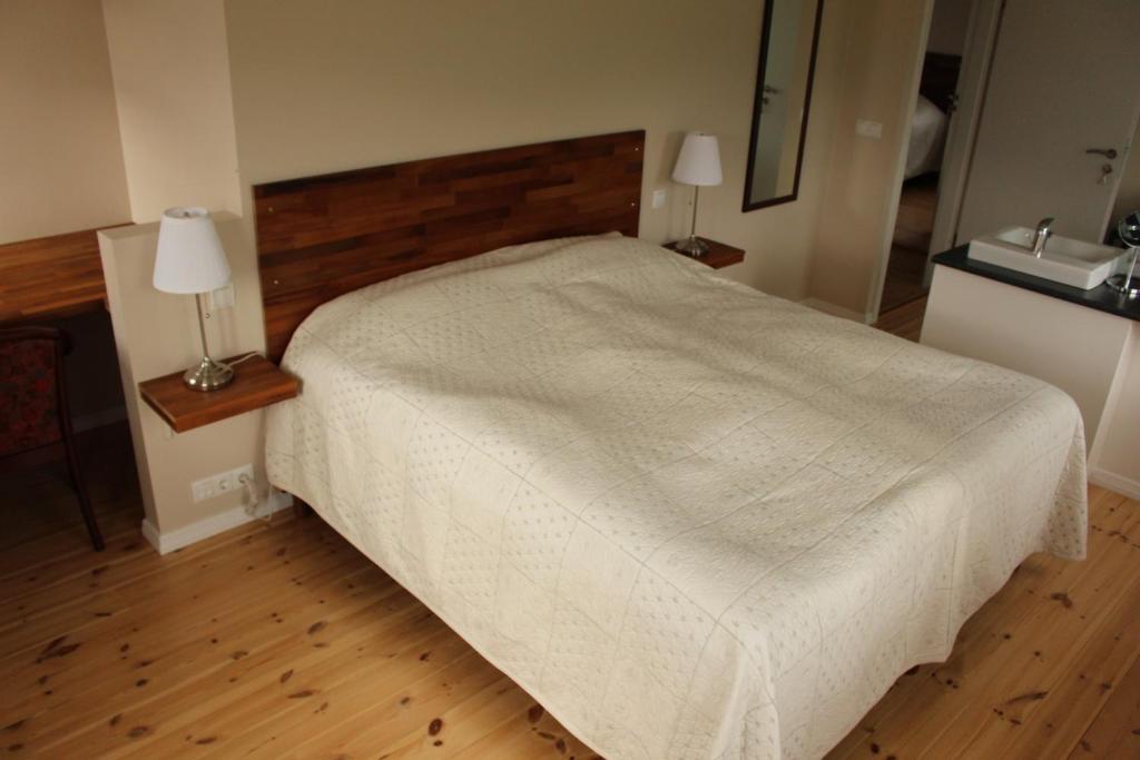 Postel nebo postele na pokoji v ubytování Kolkuós Guesthouse