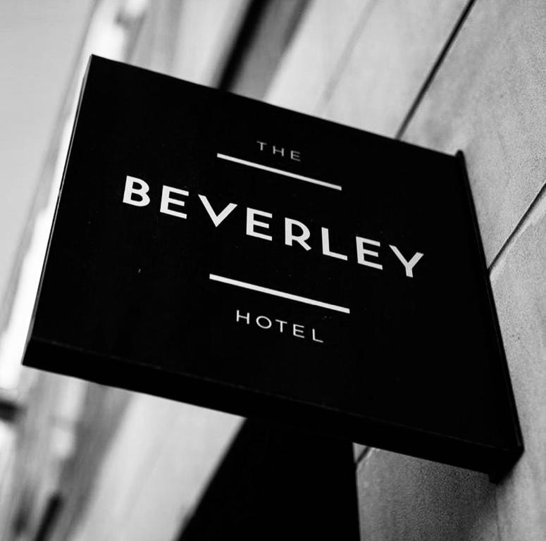 a sign for the beverley hotel on a building at The Beverley Hotel in Toronto