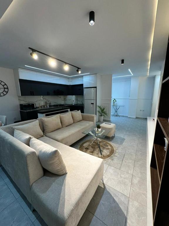 a living room with a couch and a table at Yasmina lodge in Bejaïa