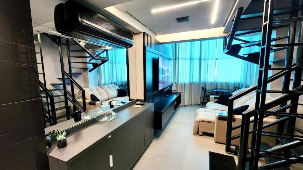 Μια τηλεόραση ή/και κέντρο ψυχαγωγίας στο Duplex de Luxo e Confortável no Bahamas