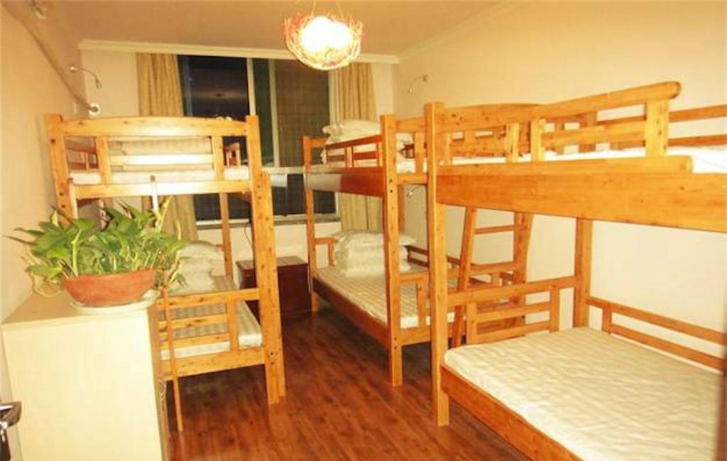 Postel nebo postele na pokoji v ubytování Xi'an The Facebook Youth Hostel