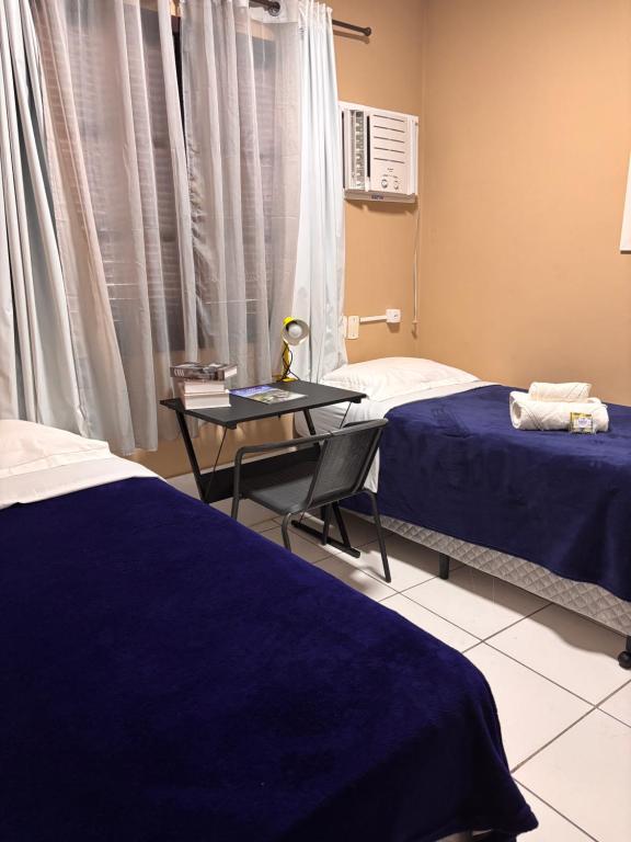 En eller flere senge i et værelse på Casa a 150m da Praia Barra da Tijuca