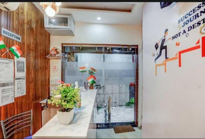 a room with a counter with a potted plant at Hotel O Seventy stay in in Mohali