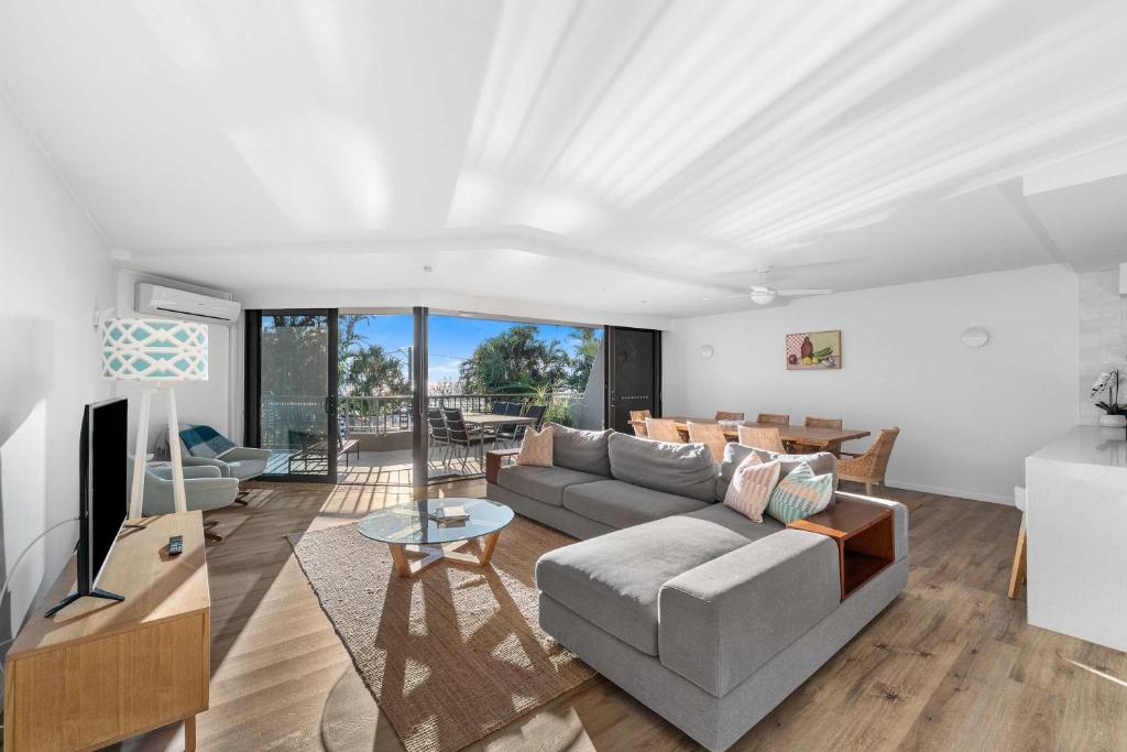 a living room with a couch and a table at The Rocks Resort 1C in Gold Coast