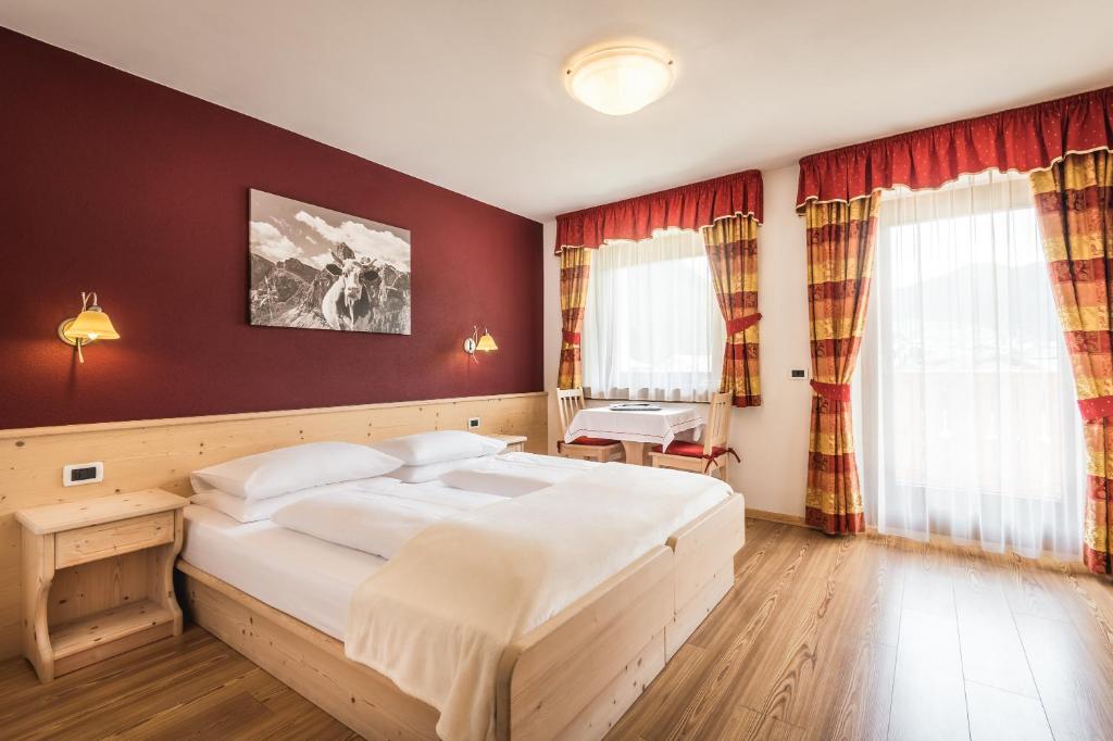 Postel nebo postele na pokoji v ubytování Hotel Pradat
