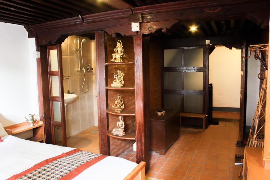 Postel nebo postele na pokoji v ubytování Hiranya Guest House