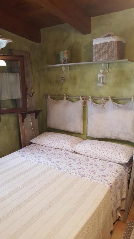 Postel nebo postele na pokoji v ubytování B&B La Rosa Antica