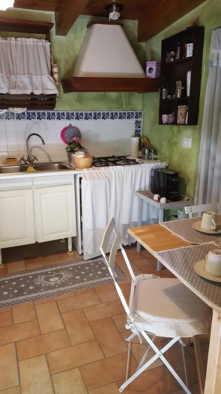 Kuchyň nebo kuchyňský kout v ubytování B&B La Rosa Antica
