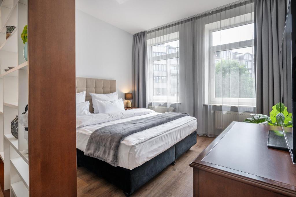 מיטה או מיטות בחדר ב-Munich Furnished Apartments