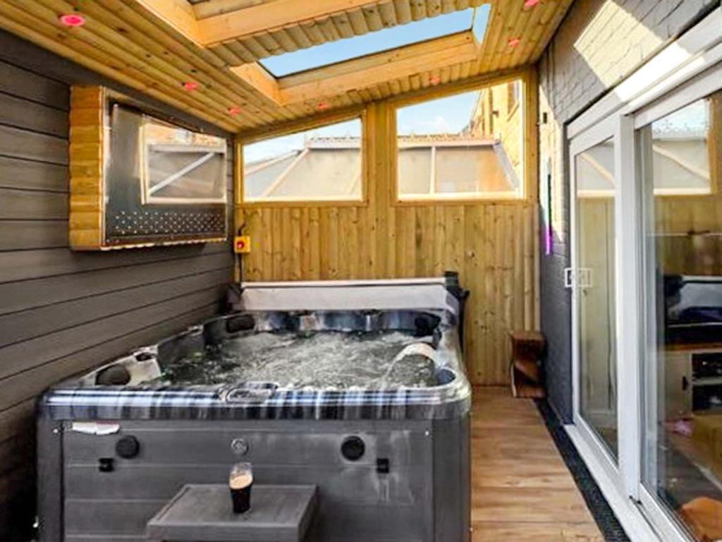 a large bathroom with a tub in a house at Lawsons Lodge in Whitby