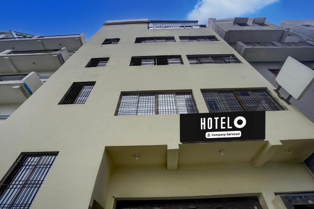 a hotel sign on the side of a building at Super Hotel O Juran Chapra Muzaffarpur Formerly Ramco Residential in Muzaffarpur